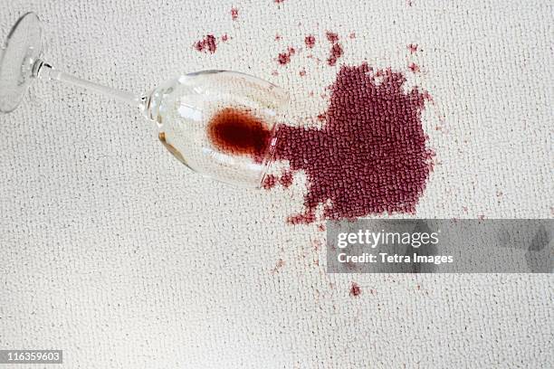 close up of spoiled red wine on white background - rood kleed stockfoto's en -beelden