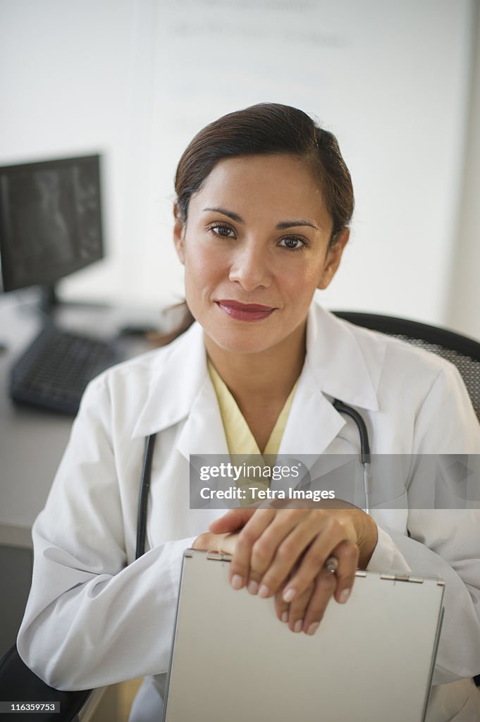 USA, New Jersey, Jersey City, portrait of smiling female doctor