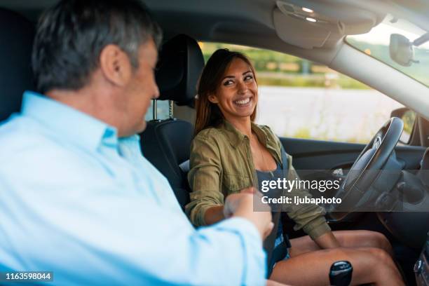 cute woman at driving school - driving course stock pictures, royalty-free photos & images