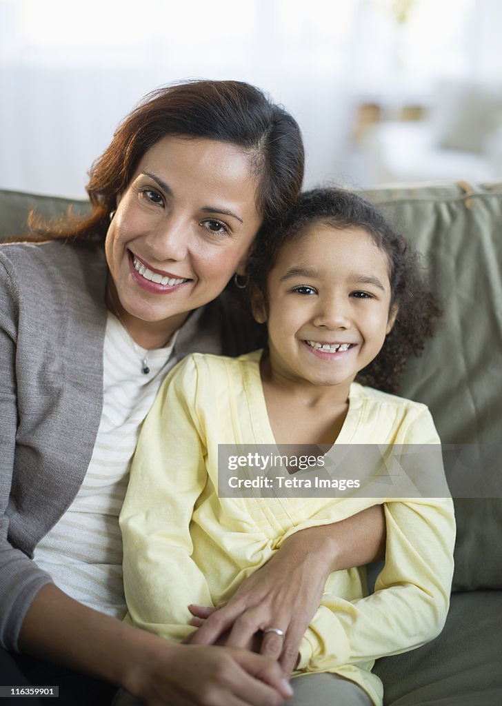 USA, New Jersey, Jersey City, portrait of smiling mother embracing daughter (6-7)