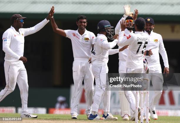 Sri Lankan cricketer Lasith Embuldeniya celebrates with Angelo Mathews, Kusal Mendis,Dhananjaya de Silva, Dinesh Chandimal and Sri Lankan cricket...