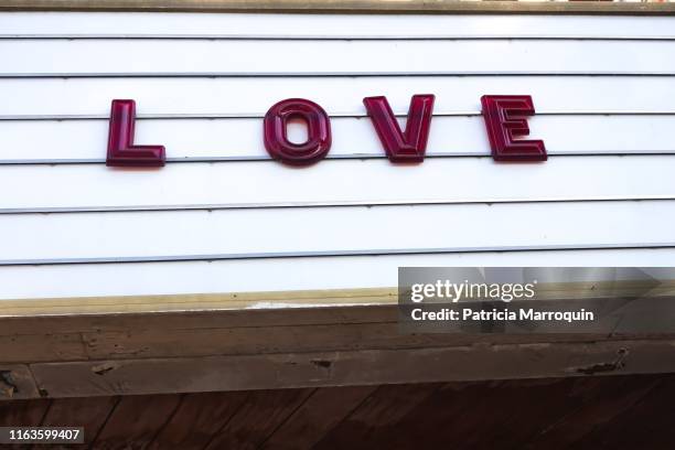 “love” on the marquee - insegna di teatro foto e immagini stock