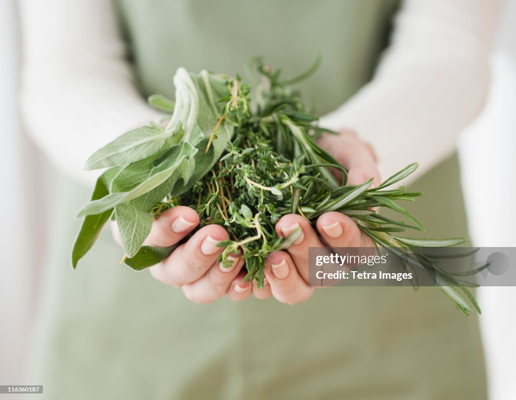 Woman holding herbs