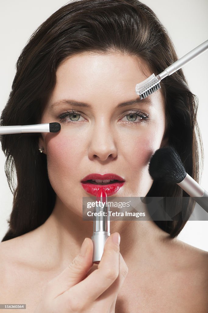 Woman having make up applied