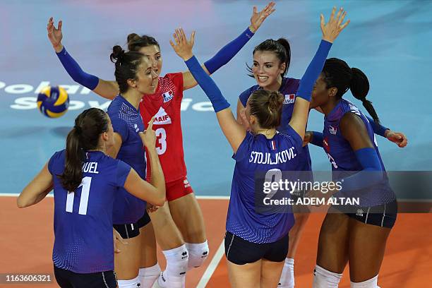 France's players react to a point against Greece after the 2019 Women's European Volleyball Championship match between France and Greece in Ankara,...
