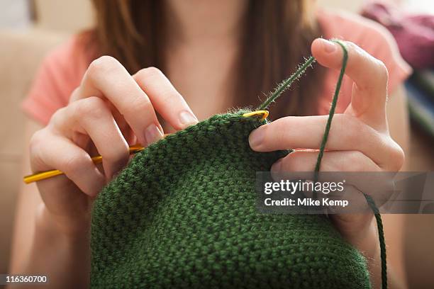 usa, utah, lehi, young woman knitting woolly hat - knitting stock pictures, royalty-free photos & images