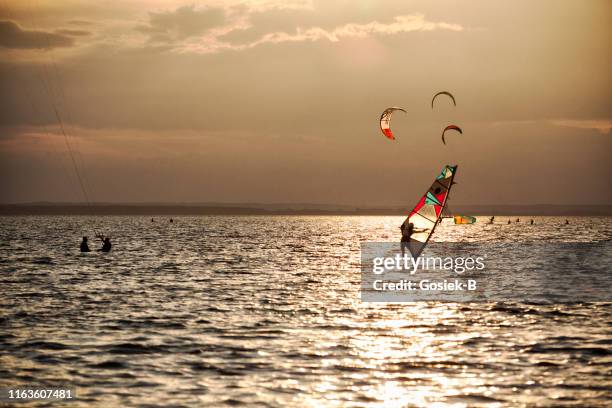 kitesurfing in the natural park in hel in poland - helium stock pictures, royalty-free photos & images