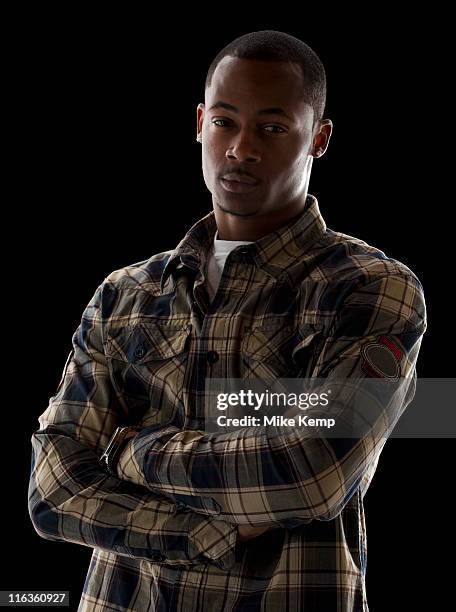 studio portrait of young man - black man plaid shirt stock pictures, royalty-free photos & images