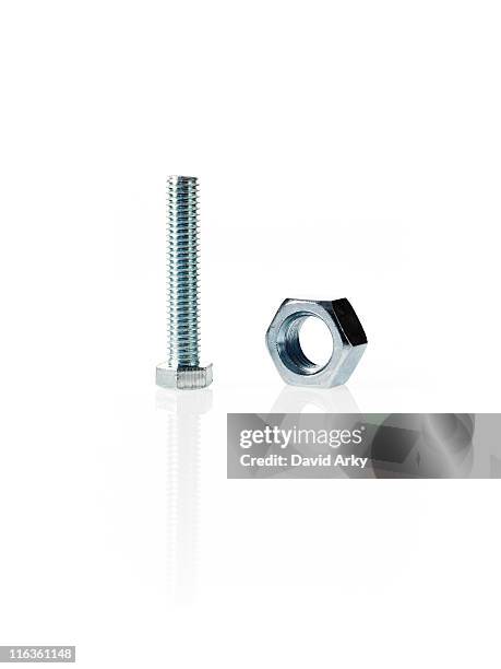 studio shot of bolt and nut - nut fastener stock pictures, royalty-free photos & images