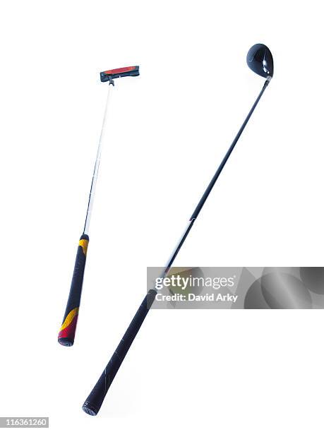 two golf clubs on white background - golfclub stockfoto's en -beelden