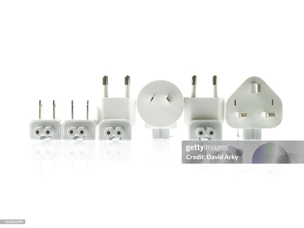 Row of plugs on white background