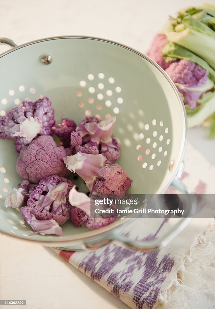 Studio shot of cauliflower in colander