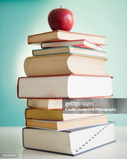 Book Stack With Ruler Apple Stack Of Books And Apple Photos and Premium High Res Pictures - Getty ...