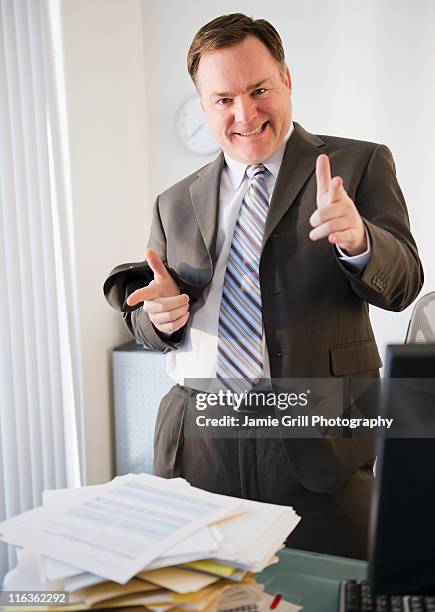 usa, jersey city, new jersey, businessman pointing to camera - smug 個照片及圖片檔