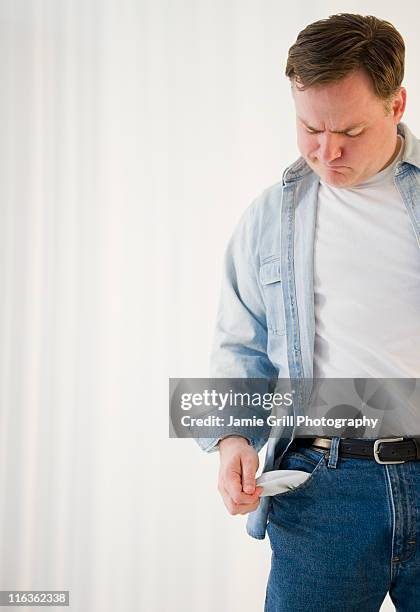 usa, jersey city, new jersey, man emptying pockets - empty pockets stock pictures, royalty-free photos & images