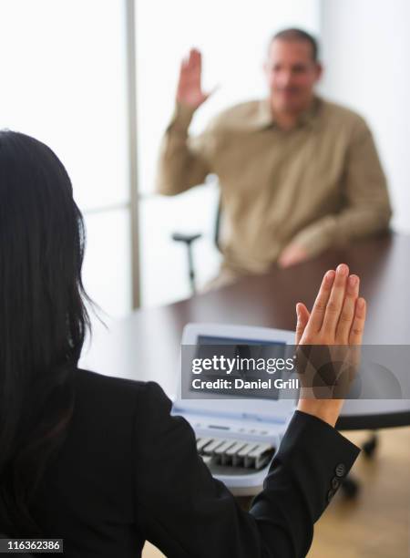 usa, jersey city, new jersey, court stenographer and client raising hands - macchina per stenografare foto e immagini stock