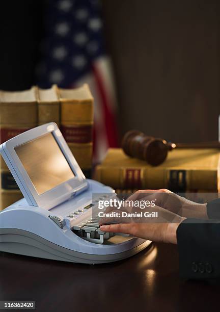 usa, jersey city, new jersey, court stenographer using stenograph machine - court reporter stock pictures, royalty-free photos & images