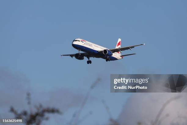 British Airways BAW BA Airbus A321-200 aircraft on final approach, while landing at runway 27R at London Heathrow International Airport LHR EGLL in...