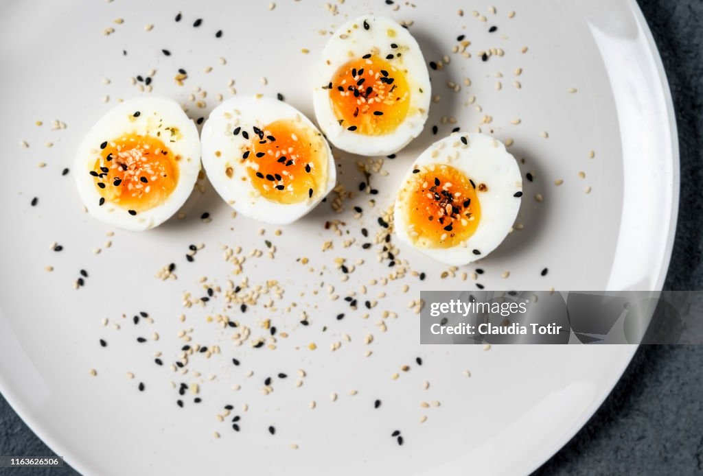 Halved hard-boiled eggs on a plate