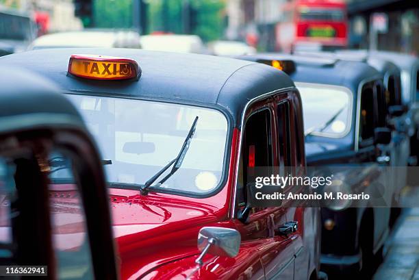 uk, england, london, row of cabs - london taxi stock pictures, royalty-free photos & images