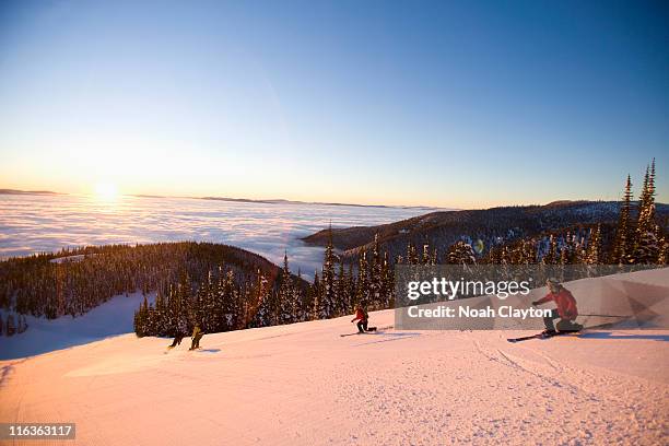 usa, montana, whitefish, four people skiing - whitefish stock pictures, royalty-free photos & images