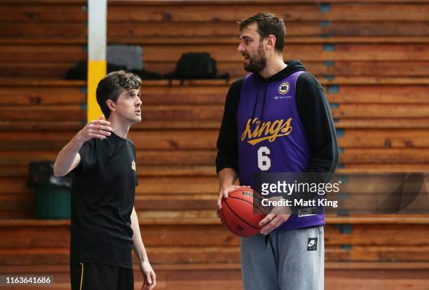 Kings coach Will Weaver talks to Andrew Bogut during the Sydney Kings pre-season camp at Auburn Basketball Centre on July 23, 2019 in Sydney,...