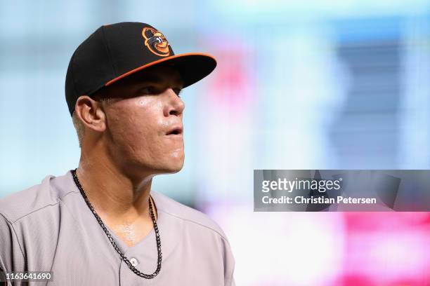 Starting pitcher Aaron Brooks of the Baltimore Orioles walks off the field during first inning of the MLB game against the Arizona Diamondbacks at...