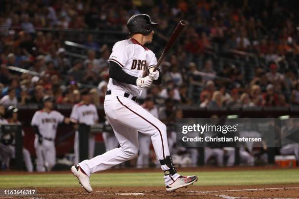 Jake Lamb of the Arizona Diamondbacks hits a RBI double against the Baltimore Orioles during third inning of the MLB game at Chase Field on July 22,...