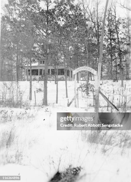 Wintry view of the entrance gate to the Oakmere Hotel, Idlewild, Michigan, 1938. The hotel was founded by African-American Dr. Daniel Hale Williams,...