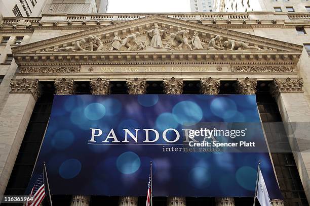 Banner for Pandora Media Inc., the online-radio company, hangs in front of the New York Stock Exchange walk on its first day of trading as a public...