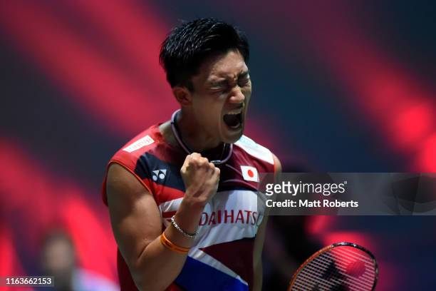 Kento Momota of Japan celebrates against Hans-kristian Solberg Vittinghus of Denmark during day one of the Daihatsu Yonex Japan Open Badminton...