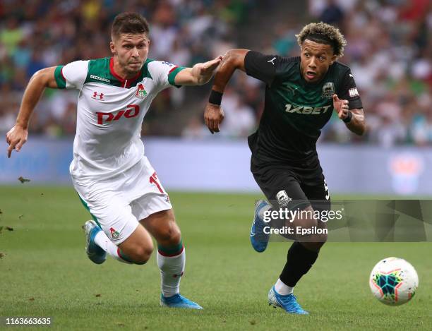 Tonny Vilhena of FC Krasnodar vies for the ball with Rifat Zhemaletdinov of FC Lokomotiv Moscow during the Russian Premier League match between FC...