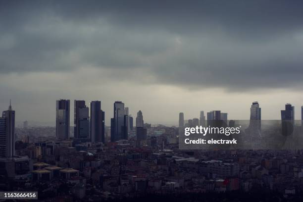 heavy clouds over the city - dramatic weather over istanbul stock pictures, royalty-free photos & images