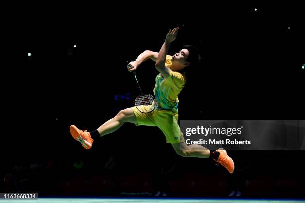 Kantaphon Wangcharoen of Thailand competes against Mark Caljouw of Netherlands during day one of the Daihatsu Yonex Japan Open Badminton...