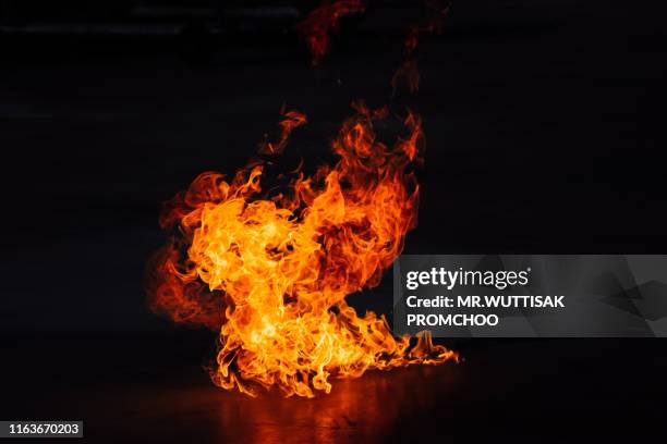 fire on a black background. - bola de fuego fotografías e imágenes de stock