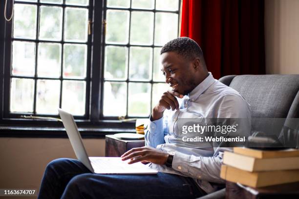 Young business man working from home using a laptop