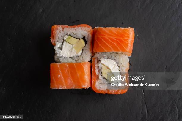 https://media.gettyimages.com/id/1163688872/photo/salmon-sushi-on-black-surface.jpg?s=612x612&w=gi&k=20&c=N9nqXgJfe5-0wNrFXjCwt2uj_fRqB0XQ6qHLKpA2Oug=