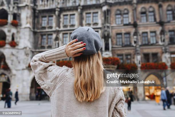 woman wearing beret by new town hall in munich, germany - beret stock pictures, royalty-free photos & images