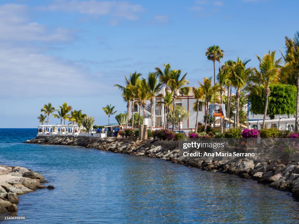 View of Port of Mogan village with white houses on the seashore