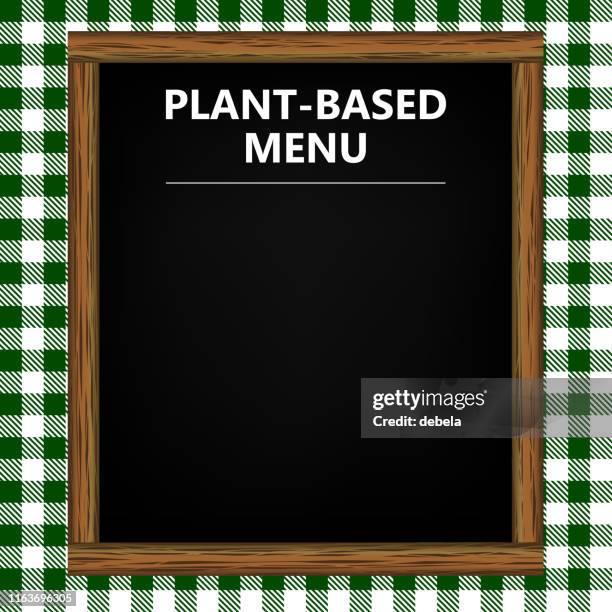 plant-based menu blackboard on green gingham pattern background - pub menu board stock illustrations