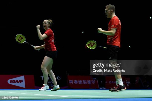 Thom Gicquel and Delphine Delrue of France celebrate against Tontowi Ahmad and Winny Oktavina of Indonesia during day one of the Daihatsu Yonex Japan...