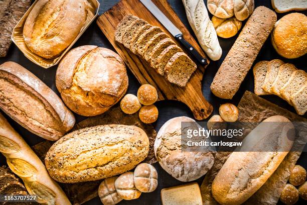 breads assortment background - bun bread stock pictures, royalty-free photos & images