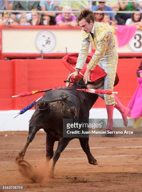 Spanish bullfighter Fernando Molina performs during a bullfight as part of the Feria Santiago at Coso de Cuatro Caminos on July 22, 2019 in...
