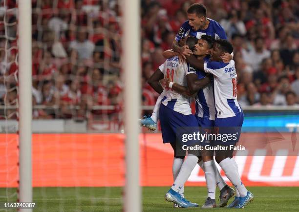 Moussa Marega of FC Porto celebrates with teammates after scoring a goal during the Liga NOS match between SL Benfica and FC Porto at Estadio da Luz...