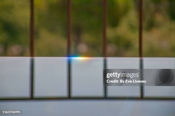 sun flare on a glass table - frosted glass ストックフォトと画像