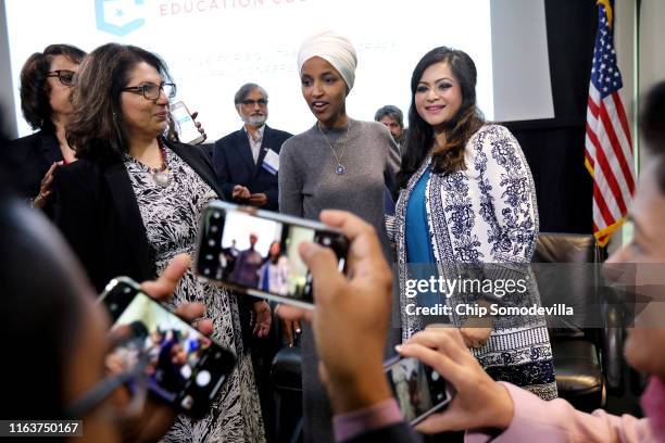 Rep. Ilhan Omar poses for photographs at the conclusion of a panel discussion during the Muslim Collective For Equitable Democracy Conference and...