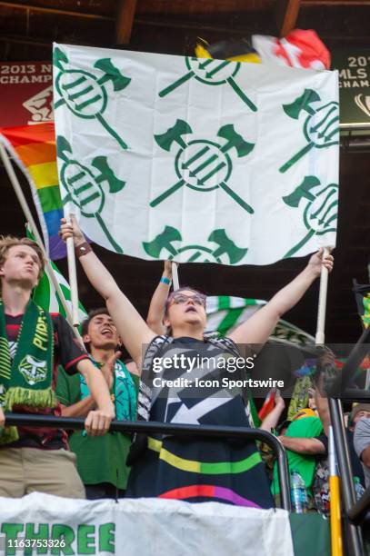 At minute 33 of the first half, the Timbers Army supporters group break their silence and displays numerous flags and versions of the iron front...