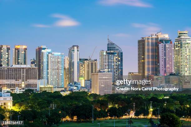 close up of manila night skylines - philippinen stock-fotos und bilder