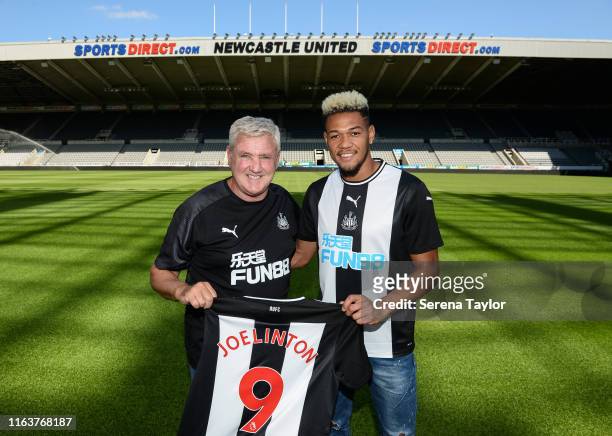 Joelinton poses for a photograph with Newcastle United Head Coach Steve Bruce during a photoshoot at St.James' Park on July 22, 2019 in Newcastle...