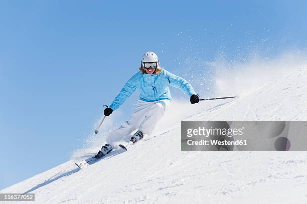 italy, trentino-alto adige, alto adige, bolzano, seiser alm, young woman skiing - woman skiing stock pictures, royalty-free photos & images